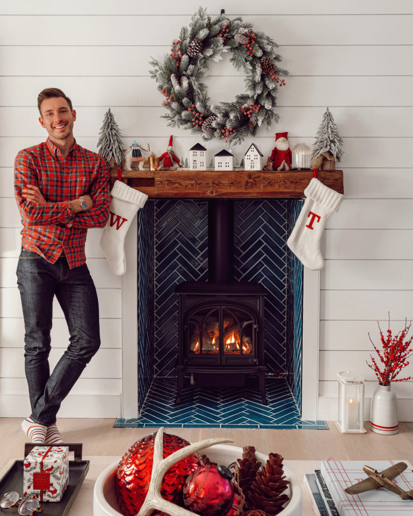 design blogger Will Taylor next to his fireplace