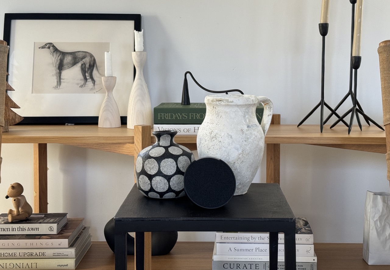 side table with smart speaker and modern rustic vases showing how to hide smart tech