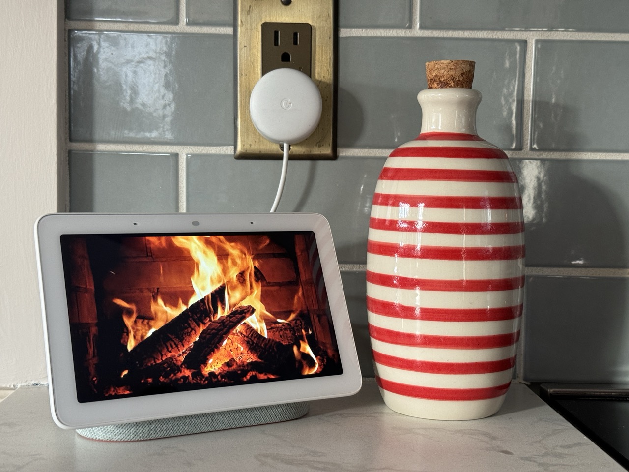 Google Home Hub showing a fireplace on it, showing how to hide smart tech